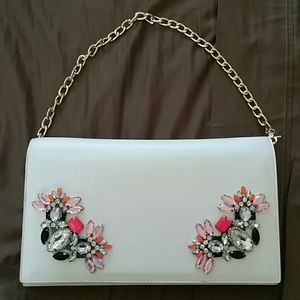 Bebe clutch with chain and jeweled embellishments